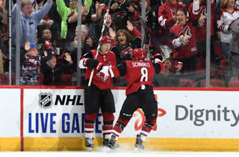 GLENDALE, ARIZONA – OCTOBER 10: Nick Schmaltz #8 of the Arizona Coyotes celebrates with teammate Christian Dvorak #18 after scoring a goal against the Vegas Golden Knights during the first period at Gila River Arena on October 10, 2019 in Glendale, Arizona. (Photo by Norm Hall/NHLI via Getty Images)