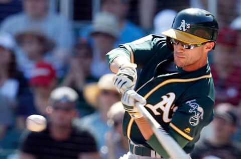 Mar 4, 2016; Salt River Pima-Maricopa, AZ, USA; Oakland Athletics left fielder Sam Fuld (23) hits in the first inning against the Arizona Diamondbacks during a spring training game at Salt River Fields at Talking Stick. Mandatory Credit: Rick Scuteri-USA TODAY Sports. World Baseball Classic.