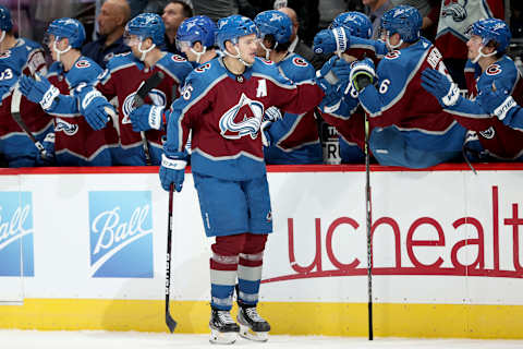 DENVER, COLORADO – NOVEMBER 22: Mikko Rantanen #96 of the Colorado Avalanche celebrates with his teammates after scoring against the Ottawa Senators in the third period at Ball Arena on November 22, 2021, in Denver, Colorado. (Photo by Matthew Stockman/Getty Images)