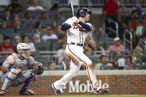 Jun 30, 2021; Atlanta, Georgia, USA; Atlanta Braves first baseman Freddie Freeman (5) hits an RBI single against the New York Mets during the fourth inning at Truist Park. Mandatory Credit: Brett Davis-USA TODAY Sports