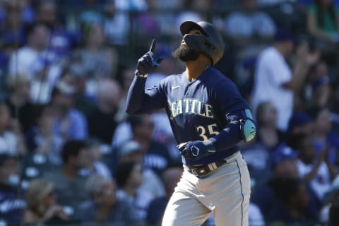 Apr 12, 2023; Chicago, Illinois, USA; Seattle Mariners right fielder Teoscar Hernandez (35) celebrates as he rounds the bases after hitting a solo home run against the Chicago Cubs during the eight inning at Wrigley Field. Mandatory Credit: Kamil Krzaczynski-USA TODAY Sports