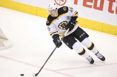 Nov 23, 2015; Toronto, Ontario, CAN; Boston Bruins defenseman Colin Miller (48) skates with the puck against the Toronto Maple Leafs at Air Canada Centre. The Bruins beat the Maple Leafs 4-3 in the shootout. Mandatory Credit: Tom Szczerbowski-USA TODAY Sports