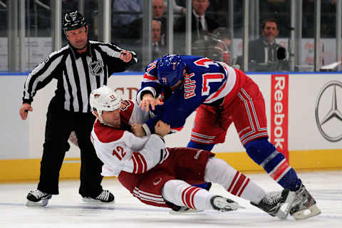 NEW YORK, NY – JANUARY 10: Paul Bissonnette #12 of the Phoenix Coyotes fights Mike Rupp #71 of the New York Rangers at Madison Square Garden on January 10, 2012 in New York City. (Photo by Chris Trotman/Getty Images)