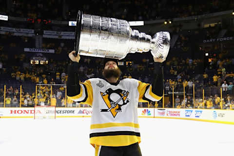 NASHVILLE, TN – JUNE 11: Nick Bonino #13 of the Pittsburgh Penguins celebrates with the Stanley Cup Trophy after they defeated the Nashville Predators 2-0 in Game Six of the 2017 NHL Stanley Cup Final at the Bridgestone Arena on June 11, 2017 in Nashville, Tennessee. (Photo by Bruce Bennett/Getty Images)