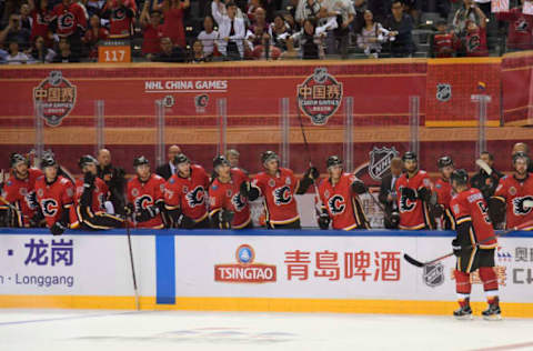 SHENZHEN, CHN – SEPTEMBER 15: Mark Giordano #5 of the Calgary Flames celebrates a goal against the Boston Bruins at the Universiade Sports Center on September 15, 2018 in Shenzhen, China. (Photo by Brian Babineau/NHLI via Getty Images)