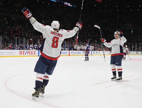 UNIONDALE, NEW YORK – JANUARY 18: Alex Ovechkin #8 of the Washington Capitals celebrates his empty net goal against the New York Islanders which tied him with Steve Yzerman on the NHL all time goal scoring list at NYCB Live’s Nassau Coliseum on January 18, 2020 in Uniondale, New York. The Capitals defeated the Islanders 6-4. (Photo by Bruce Bennett/Getty Images)