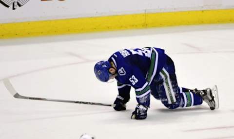 Jan 11, 2016; Vancouver, British Columbia, CAN; Vancouver Canucks forward Bo Hovat (53) goes down after a shot to the leg during the second period against the Florida Panthers at Rogers Arena. Mandatory Credit: Anne-Marie Sorvin-USA TODAY Sports