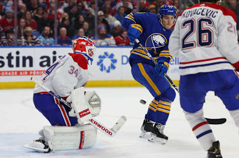 Mar 27, 2023; Buffalo, New York, USA; Buffalo Sabres center Tyson Jost (17) tries to redirect a shot on Montreal Canadiens goaltender Jake Allen (34) during the second period at KeyBank Center. Mandatory Credit: Timothy T. Ludwig-USA TODAY Sports