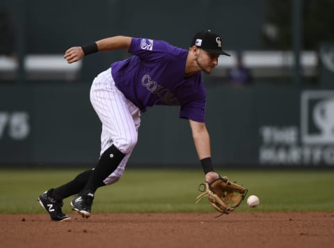 DENVER, CO – JULY 25: Colorado Rockies second baseman Garrett Hamppson #7 scoops up the ball and throws out Houston Astros third baseman Alex Breggman #2 at first in the first inning at Coors Field July 25, 2018. (Photo by Andy Cross/The Denver Post via Getty Images)