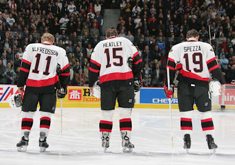 VANCOUVER – DECEMBER 9: Daniel Alfredsson #11, Dany Heatley #15 and Jason Spezza #19 of the Ottawa Senators line up during the National Anthem before the NHL game against the Vancouver Canucks at General Motors Place on December 9, 2005 in Vancouver, Canada. The Canucks defeated the Senators 3-2. (Photo by Jeff Vinnick/Getty Images)