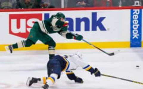 Dec 11, 2016; Saint Paul, MN, USA; Minnesota Wild forward Mikael Granlund (64) scores an empty net goal in the third period against the St Louis Blues at Xcel Energy Center. The Minnesota Wild beat the St Louis Blues 3-1. Mandatory Credit: Brad Rempel-USA TODAY Sports