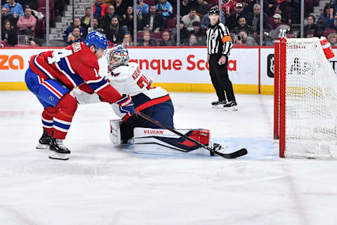 MONTREAL, CANADA – APRIL 06: Nick Suzuki #14 of the Montreal Canadiens gets the puck past goaltender Darcy Kuemper #35 of the Washington Capitals during the second period at Centre Bell on April 6, 2023 in Montreal, Quebec, Canada. (Photo by Minas Panagiotakis/Getty Images)