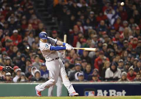 BOSTON, MA – OCTOBER 23: Mannny Machado #8 of the Los Angeles Dodgers hits an RBI sac-fly during the seventh inning against the Boston Red Sox in Game One of the 2018 World Series at Fenway Park on October 23, 2018 in Boston, Massachusetts. (Photo by Maddie Meyer/Getty Images)