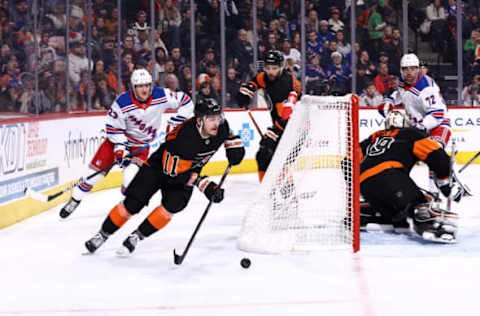 PHILADELPHIA, PENNSYLVANIA – DECEMBER 17: Travis Konecny #11 of the Philadelphia Flyers skates with the puck against the New York Rangers at Wells Fargo Center on December 17, 2022, in Philadelphia, Pennsylvania. (Photo by Tim Nwachukwu/Getty Images)