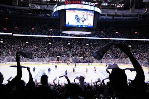 Apr 15, 2015; Vancouver, British Columbia, CAN; Vancouver Canucks fans celebrate forward Bo Horvat (53) goal against Calgary Flames goaltender Jonas Hiller (1) (not pictured) during the second period in game one of the first round of the the 2015 Stanley Cup Playoffs at Rogers Arena. Mandatory Credit: Anne-Marie Sorvin-USA TODAY Sports