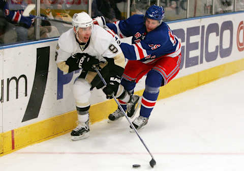 NEW YORK – MARCH 18: Pascal Dupuis #9 of the Pittsburgh Penguins carries the puck against Christian Backman #55 of the New York Rangers on March 18, 2008 at Madison Square Garden in New York City. (Photo by Jim McIsaac/Getty Images)