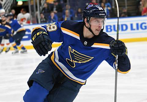 ST. LOUIS, MO. – DECEMBER 16: St. Louis Blues defenseman Vince Dunn (29) goes after a loose puck during a NHL game between the Calgary Flames and the St. Louis Blues on December 16, 2018, at Enterprise Center, St. Louis, MO. (Photo by Keith Gillett/Icon Sportswire via Getty Images)