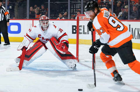 PHILADELPHIA, PA – MARCH 05: Alex Nedeljkovic #39 of the Carolina Hurricanes watches Jakub Voracek #93 of the Philadelphia Flyers in the third period at Wells Fargo Center on March 5, 2020 in Philadelphia, Pennsylvania. The Flyers won 4-1. (Photo by Drew Hallowell/Getty Images)