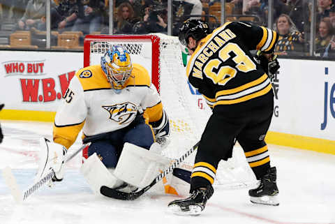 BOSTON, MA – DECEMBER 22: Boston Bruins left wing Brad Marchand (63) tries to jam the puck underneath Nashville Predators goalie Pekka Rinne (35) during a game between the Boston Bruins and the Nashville Predators on December 22, 2018, at TD Garden in Boston, Massachusetts. (Photo by Fred Kfoury III/Icon Sportswire via Getty Images)