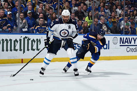 ST. LOUIS, MO – APRIL 16: Pat Maroon #7 of the St. Louis Blues pressures Dustin Byfuglien #33 of the Winnipeg Jets in Game Four of the Western Conference First Round during the 2019 NHL Stanley Cup Playoffs at Enterprise Center on April 16, 2019 in St. Louis, Missouri. (Photo by Joe Puetz/NHLI via Getty Images)