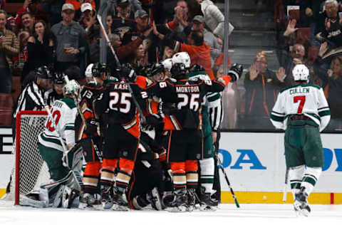 ANAHEIM, CA Brandon Montour #26 and Ondrej Kase #25 of the Anaheim Ducks celebrate a second-period goal against Matt Cullen #7 and the Minnesota Wild on April 4, 2018 at Honda Center in Anaheim, California. (Photo by Debora Robinson/NHLI via Getty Images)