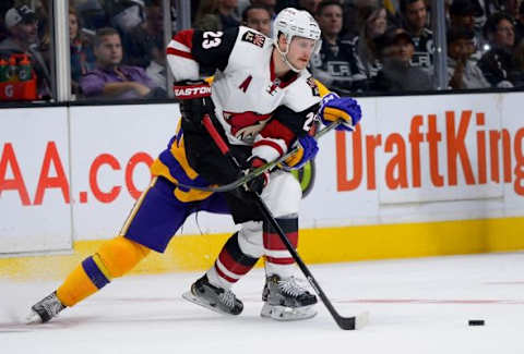 Nov 10, 2015; Los Angeles, CA, USA; Los Angeles Kings center Trevor Lewis (22) defends Arizona Coyotes defenseman Oliver Ekman-Larsson (23) in the second period of the game at Staples Center. Mandatory Credit: Jayne Kamin-Oncea-USA TODAY Sports