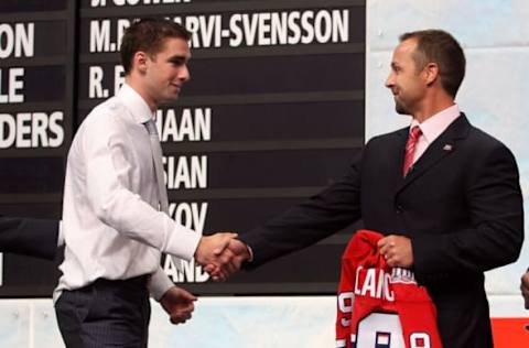 Louis Leblanc greets Director of Player Recruitment and Development Trevor Timmins of the Montreal Canadiens after Leblanc was selected #18 overall by the Canadiens during the first round of the 2009 NHL Entry Draft at the Bell Centre on June 26, 2009 in Montreal, Quebec, Canada. (Photo by Bruce Bennett/Getty Images)