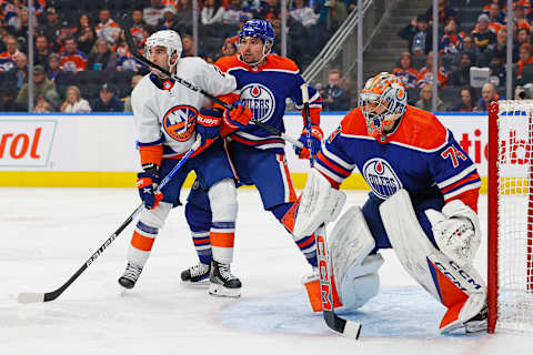 Nov 13, 2023; Edmonton, Alberta, CAN; New York Islanders forward Kyle Palmieri (21) and Edmonton Oilers defensemen Cody Ceci (5) battle for position in front of goaltender Stuart Skinner (74) during the second period at Rogers Place. Mandatory Credit: Perry Nelson-USA TODAY Sports