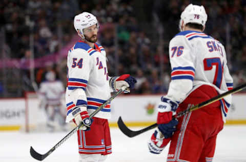 DENVER, COLORADO – JANUARY 04: Adam McQuaid #54 and Brady Skjei #76 of the New York Rangers confer before a faceoff against the Colorado Avalanche in the third period at the Pepsi Center on January 04, 2019 in Denver, Colorado. (Photo by Matthew Stockman/Getty Images)