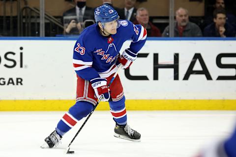 Mar 15, 2022; New York, New York, USA; New York Rangers defenseman Adam Fox (23) controls the puck against the Anaheim Ducks during the third period at Madison Square Garden. Mandatory Credit: Brad Penner-USA TODAY Sports