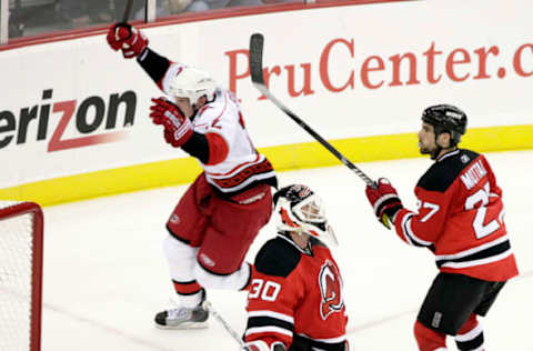 The Carolina Hurricanes’ Eric Staal (12) celebrates after he scored against the New Jersey Devils’ Martin Brodeur (30) and Mike Mottau (27) during third period action in Game 7 of the NHL playoffs at the Prudential Center in Newark, New Jersey, Tuesday, April 28, 2009. The Hurricanes beat the Devils 4-3 to win the best-of-seven series, four games to three. (Photo by Chris Seward/Raleigh News & Observer/MCT via Getty Images)