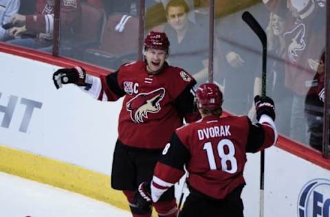 Oct 15, 2016; Glendale, AZ, USA; Arizona Coyotes right wing Shane Doan (19) celebrates with left wing Christian Dvorak (18) after scoring a goal in the first period against Philadelphia Flyers at Gila River Arena. Mandatory Credit: Matt Kartozian-USA TODAY Sports