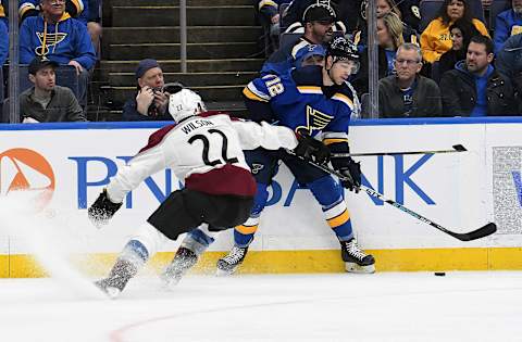 ST. LOUIS, MO – APRIL 01: Colorado Avalanche center Colin Wilson (22) and St. Louis Blues leftwing Zach Sanford (12) compete for a loose puck during a NHL game between the Colorado Avalanche and the St. Louis Blues on April 01, 2019, at Enterprise Center, St. Louis, MO. (Photo by Keith Gillett/Icon Sportswire via Getty Images)