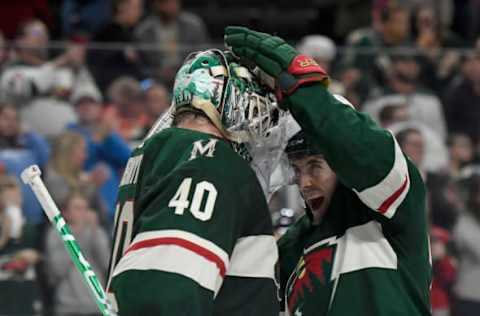 ST PAUL, MINNESOTA – OCTOBER 20: Brad Hunt #77 of the Minnesota Wild congratulates goaltender Devan Dubnyk #40 after defeating the Montreal Canadiens in the game at Xcel Energy Center on October 20, 2019, in St Paul, Minnesota. The Wild defeated the Canadiens 4-3. (Photo by Hannah Foslien/Getty Images)