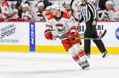 LAVAL, QC, CANADA – DECEMBER 29: Aleksi Saarela #7 of the Charlotte Checkers skating up the ice against the Laval Rocket close behind at Place Bell on December 29, 2018 in Laval, Quebec. (Photo by Stephane Dube /Getty Images)