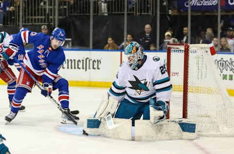 Dec 3, 2023; New York, New York, USA; San Jose Sharks goaltender Mackenzie Blackwood (29) makes a save on a shot on goal attempt by New York Rangers left wing Alexis Lafreniere (13) in the second period at Madison Square Garden. Mandatory Credit: Wendell Cruz-USA TODAY Sports