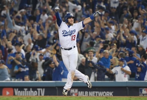 LOS ANGELES, CA – OCTOBER 26: Max Munncy #13 of the Los Angeles Dodgers celebrates his eighteenth inning walk-off home run to defeat the the Boston Red Sox 3-2 in Game Three of the 2018 World Series at Dodger Stadium on October 26, 2018 in Los Angeles, California. (Photo by Harry How/Getty Images)