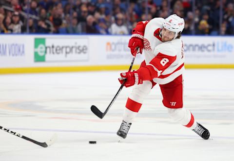 Dec 29, 2022; Buffalo, New York, USA; Detroit Red Wings defenseman Ben Chiarot (8) takes a shot on goal during the third period against the Buffalo Sabres at KeyBank Center. Mandatory Credit: Timothy T. Ludwig-USA TODAY Sports