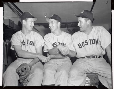 (Original Caption) Ted Williams, (L), and Rudy York, (R), wish good luck to Boston Red Sox pitcher Mickey Harris before he took the mound to face St. Louis Cardinals in the second game of the World series here. The Cardinals beat Harris and the Bosox 3-0.