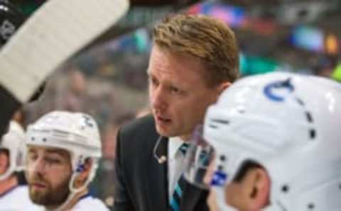 Oct 21, 2014; Dallas, TX, USA; Vancouver Canucks assistant coach Glen Gulutzan during the game against the Dallas Stars at the American Airlines Center. The Stars defeated the Canucks 6-3. Mandatory Credit: Jerome Miron-USA TODAY Sports