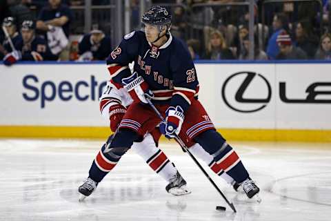 Dec 3, 2016; New York, NY, USA; New York Rangers defenseman Nick Holden (22) controls the puck against the Carolina Hurricanes during the third period at Madison Square Garden. Mandatory Credit: Adam Hunger-USA TODAY Sports