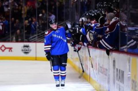 Apr 3, 2014; Denver, CO, USA; Colorado Avalanche defenseman Tyson Barrie (4) celebrates with teammates after scoring a goal during a shootout against the New York Rangers at Pepsi Center. Mandatory Credit: Ron Chenoy-USA TODAY Sports