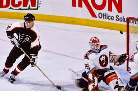 Nov 28, 1997; Philadelphia, PA, USA; FILE PHOTO; New York Islanders goalie Tommy Salo (35) makes a save against Philadelphia Flyers left wing John LeClair (10) at CoreStates Center. Mandatory Credit: Lou Capozzola-USA TODAY NETWORK