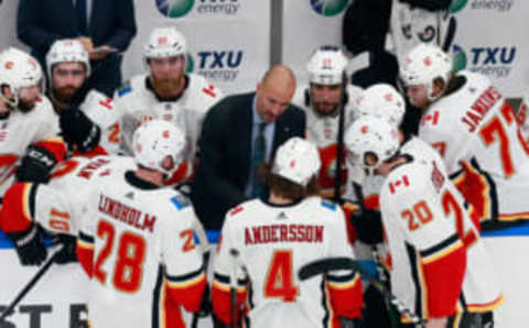 EDMONTON, ALBERTA – AUGUST 11: Assistant coach Ryan Huska of the Calgary Flames handles last minute instructions during the game against the Dallas Stars in Game One of the Western Conference First Round during the 2020 NHL Stanley Cup Playoffs at Rogers Place on August 11, 2020 in Edmonton, Alberta, Canada. The Flames defeated the Stars 3-2. (Photo by Jeff Vinnick/Getty Images)