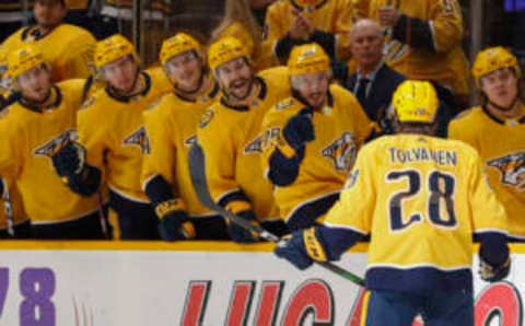 NASHVILLE, TENNESSEE – DECEMBER 04: Eeli Tolvanen #28 of the Nashville Predators is congratulated by teammates after scoring a goal against the Montreal Canadiens during the first period at Bridgestone Arena on December 04, 2021 in Nashville, Tennessee. (Photo by Frederick Breedon/Getty Images)