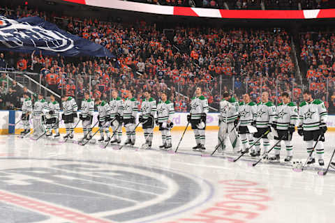 EDMONTON, AB – NOVEMBER 16: Players of the Dallas Stars stand for the singing of the national anthem prior to the game against the Edmonton Oilers on November 16, 2019, at Rogers Place in Edmonton, Alberta, Canada. (Photo by Andy Devlin/NHLI via Getty Images)