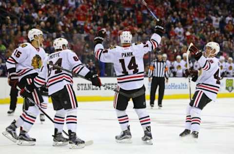 Oct 21, 2016; Columbus, OH, USA; Chicago Blackhawks right wing Richard Panik (14) celebrates with teammates center Artem Anisimov (15), center Tyler Motte (64), and defenseman Gustav Forsling (42) against the Columbus Blue Jackets in the third period at Nationwide Arena. The Blue Jackets won 3-2. Mandatory Credit: Aaron Doster-USA TODAY Sports