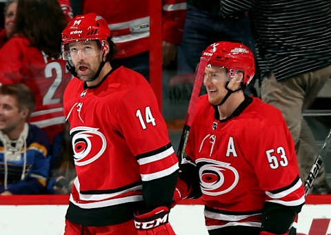 RALEIGH, NC – OCTOBER 27: Justin Williams #14 and Jeff Skinner #53 of the Carolina Hurricanes react to Skinner’s second-period goal against the St. Louis Blues during an NHL game on October 27, 2017 at PNC Arena in Raleigh, North Carolina. (Photo by Gregg Forwerck/NHLI via Getty Images)