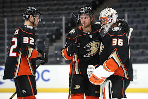 Cam Fowler #4, Jacob Larsson #32 congratulate John Gibson #36 of the Anaheim Ducks (Photo by Sean M. Haffey/Getty Images)