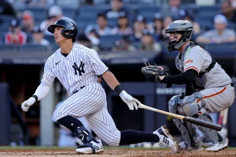 Apr 1, 2023; Bronx, New York, USA; New York Yankees shortstop Anthony Volpe (11) follows through on a single against the San Francisco Giants during the second inning at Yankee Stadium. The hit was hit first major league hit. Mandatory Credit: Brad Penner-USA TODAY Sports